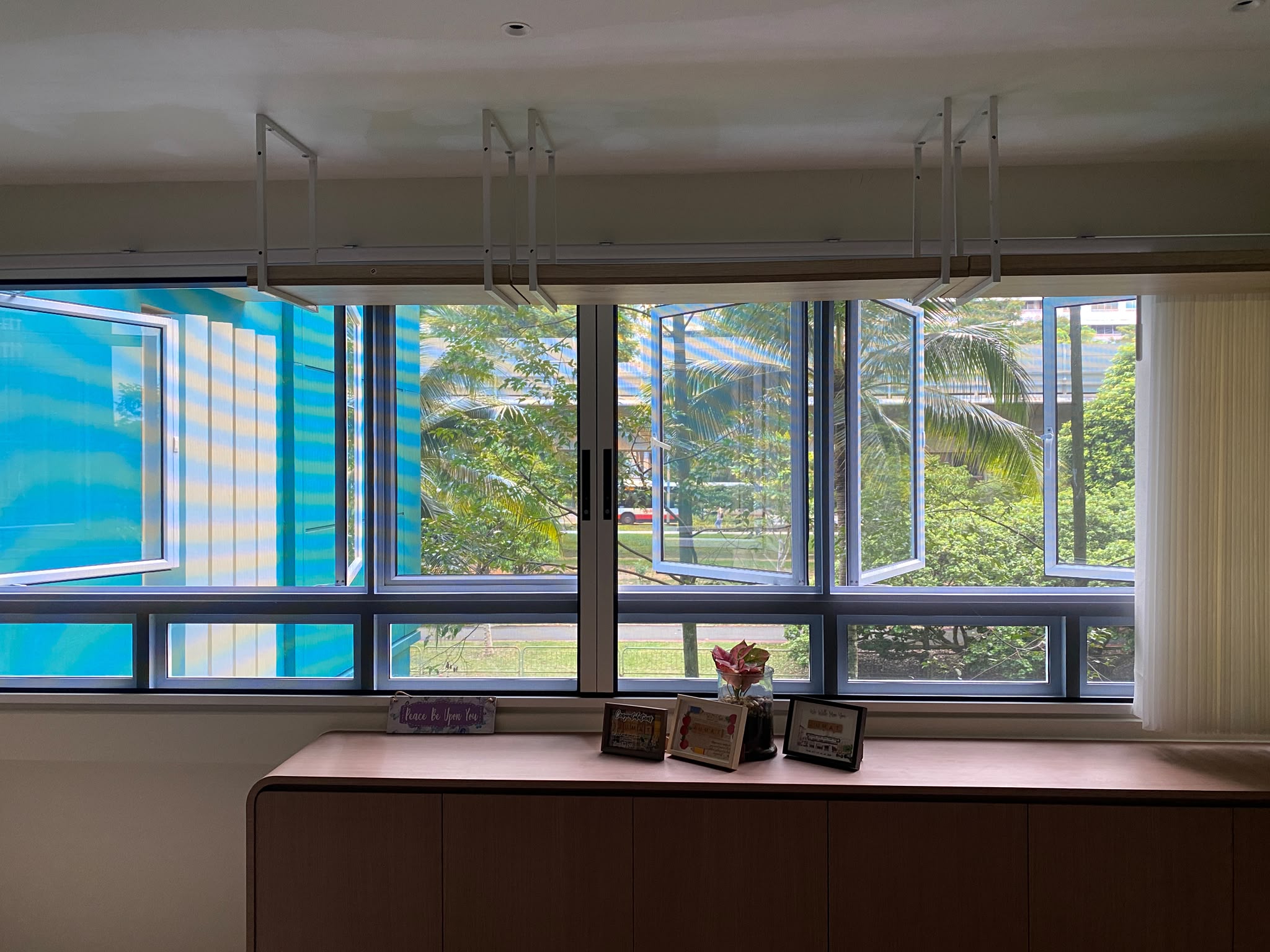 Custom PurrSafe mesh fitted across a wide multi-panel window in a Singapore home